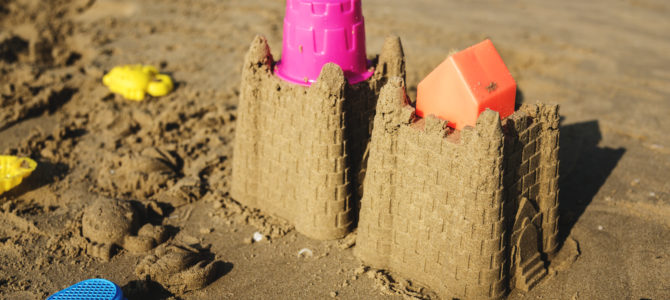 Cute sand castle on the beach